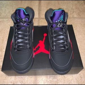 Black and purple Jordan 5s